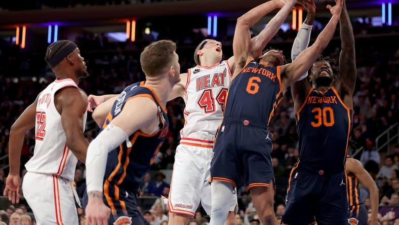 Mar 29, 2023; New York, New York, USA; New York Knicks forward Julius Randle (30) and guard Quentin Grimes (6) and center Isaiah Hartenstein (55) fights for a rebound against Miami Heat center Cody Zeller (44) and forward Jimmy Butler (22) during the first quarter at Madison Square Garden. Mandatory Credit: Brad Penner-USA TODAY Sports