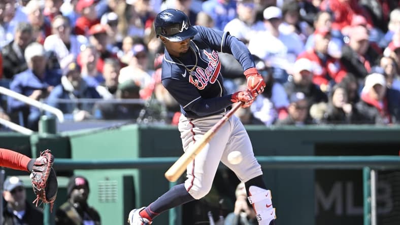 Mar 30, 2023; Washington, District of Columbia, USA; Atlanta Braves second baseman Ozzie Albies (1) hits an RBI single against the Washington Nationals during the second inning at Nationals Park. Mandatory Credit: Brad Mills-USA TODAY Sports