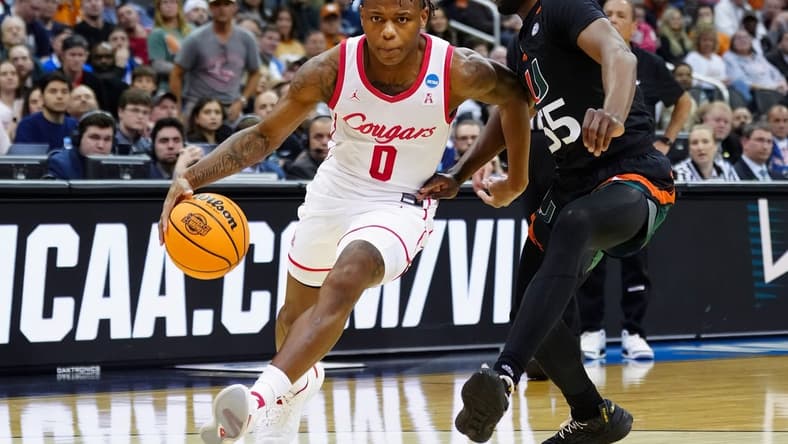 Mar 24, 2023; Kansas City, MO, USA; Houston Cougars guard Marcus Sasser (0) drives against Miami (Fl) Hurricanes guard Wooga Poplar (55) during the second half of an NCAA tournament Midwest Regional semifinal at T-Mobile Center. Mandatory Credit: Jay Biggerstaff-USA TODAY Sports