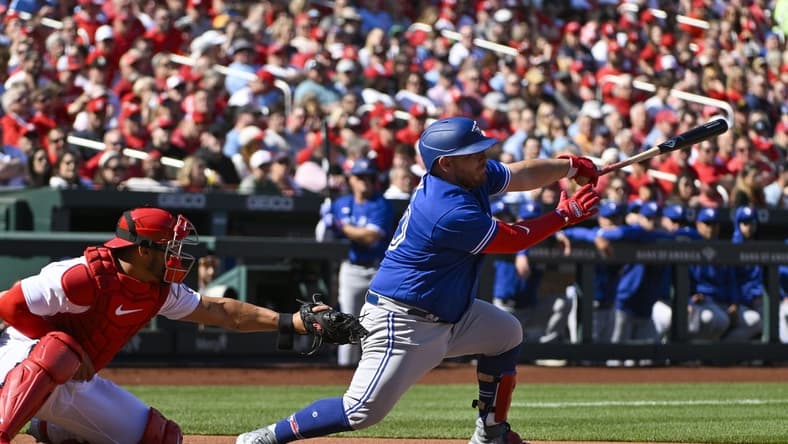 Mar 30, 2023; St. Louis, Missouri, USA; Toronto Blue Jays catcher Alejandro Kirk (30) hits a two run single against the St. Louis Cardinals during the first inning at Busch Stadium. Mandatory Credit: Jeff Curry-USA TODAY Sports