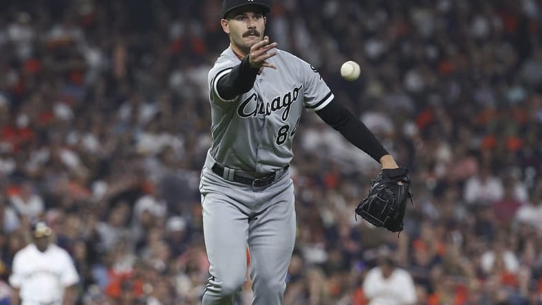 Mar 30, 2023; Houston, Texas, USA; Chicago White Sox starting pitcher Dylan Cease (84) tosses the ball to first base for an out during the fourth inning against the Houston Astros at Minute Maid Park. Mandatory Credit: Troy Taormina-USA TODAY Sports