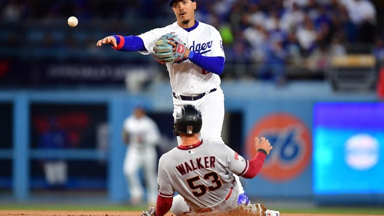 Mar 30, 2023; Los Angeles, California, USA; Arizona Diamondbacks first baseman Christian Walker (53) is out at second as Los Angeles Dodgers second baseman Miguel Vargas (17) throws to first for the out against third baseman Evan Longoria (3) during the first inning at Dodger Stadium. Mandatory Credit: Gary A. Vasquez-USA TODAY Sports