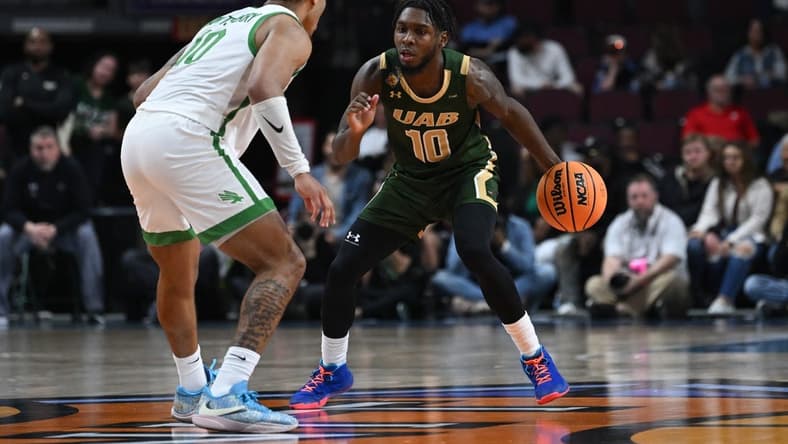 Mar 30, 2023; Las Vegas, NV, USA; North Texas Mean Green guard Kai Huntsberry (10) defends UAB Blazers guard Jordan Walker (10) in the first half at Orleans Arena. Mandatory Credit: Candice Ward-USA TODAY Sports