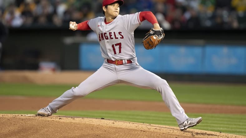 March 30, 2023; Oakland, California, USA; Los Angeles Angels starting pitcher Shohei Ohtani (17) delivers a pitch against the Oakland Athletics during the first inning at RingCentral Coliseum. Mandatory Credit: Kyle Terada-USA TODAY Sports