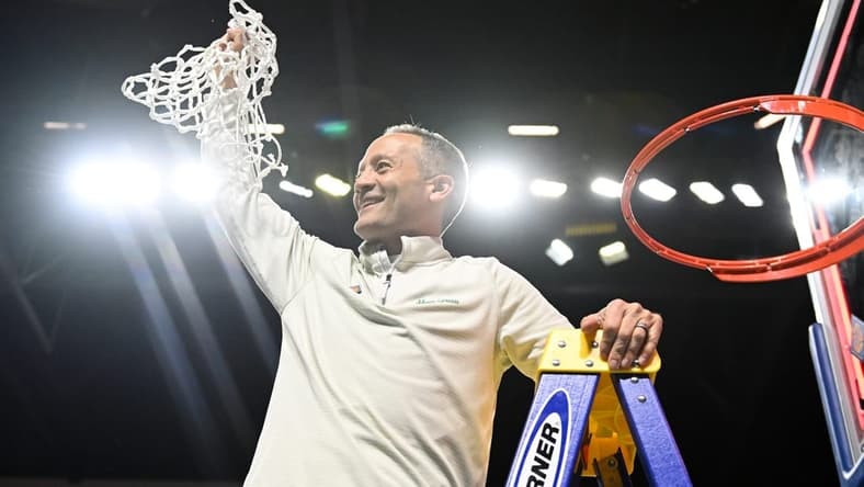 Mar 30, 2023; Las Vegas, NV, USA; North Texas Mean Green head coach Grant McCasland cuts the net after defeating the UAB Blazers to win the NIT Championship at Orleans Arena. Mandatory Credit: Candice Ward-USA TODAY Sports