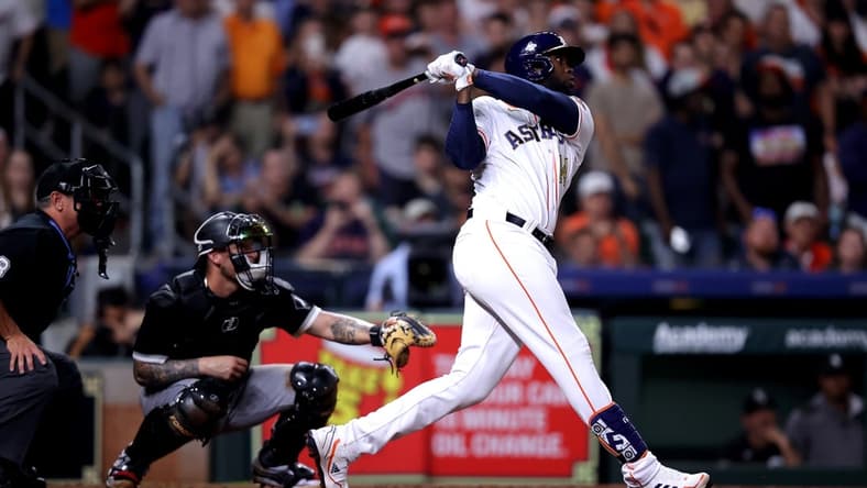 Mar 31, 2023; Houston, Texas, USA; Houston Astros designated hitter Yordan Alvarez (44) hits a three-run RBI double to center field against the Chicago White Sox during the seventh inning at Minute Maid Park. Mandatory Credit: Erik Williams-USA TODAY Sports