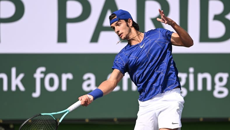 Mar 10, 2022; Indian Wells, CA, USA; Lorenzo Musetti (ITA) hits a shot in his first round match against Marcos Giron (USA) on day 4 at the BNP Paribas Open at the Indian Wells Tennis Garden. Mandatory Credit: Jayne Kamin-Oncea-USA TODAY Sports