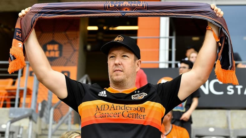 Apr 16, 2022; Houston, Texas, USA; A fan holds up a scarf in support of the Houston Dynamo FC prior to the match against the Portland Timbers at PNC Stadium. Mandatory Credit: Maria Lysaker-Houston Dynamo-USA TODAY Sports