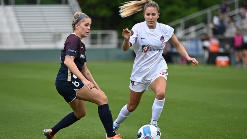 May 7, 2022; Cary, NC, USA; Washington Spirit midfielder Jordan Baggett (11) moves the ball against North Carolina Courage midfielder Denise O'Sullivan (8) at WakeMed Soccer Park. Mandatory Credit: William Howard-USA TODAY Sports