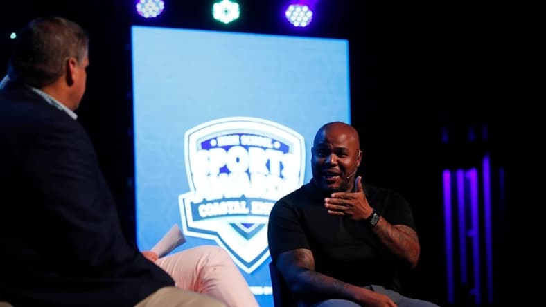 Former Atlanta Braves outfielder Andruw Jones talks with Frank Sulkowski and Amy Zimmer of WJCL 22 during the 2022 Savannah Morning News Coastal Empire High School Sports Awards at the Johnny Mercer Theatre.