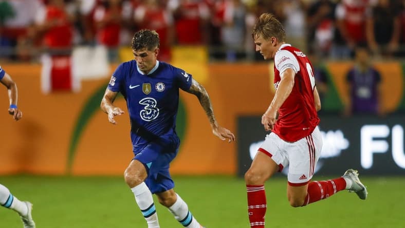 Jul 23, 2022; Orlando, FL, USA; Chelsea forward Christian Pulisic (10) runs with the ball ahead of Arsenal midfielder Martin Odegaard (8) during the second half at Camping World Stadium. Mandatory Credit: Sam Navarro-USA TODAY Sports