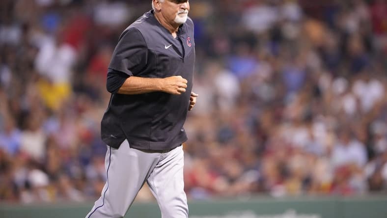Jul 25, 2022; Boston, Massachusetts, USA; Cleveland Guardians pitching coach Carl Willis (51) returns to the dugout after making a mound visit during the fourth inning against the Boston Red Sox at Fenway Park. Mandatory Credit: Gregory Fisher-USA TODAY Sports