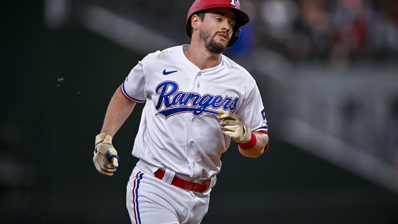 Aug 1, 2022; Arlington, Texas, USA; Texas Rangers pinch hitter Nick Solak (15) rounds the bases after he hits a home run against the Baltimore Orioles during the eighth inning at Globe Life Field. Mandatory Credit: Jerome Miron-USA TODAY Sports