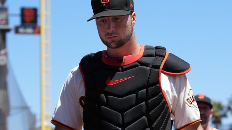 Aug 14, 2022; San Francisco, California, USA; San Francisco Giants catcher Joey Bart (21) walks to the dugout before the game against the Pittsburgh Pirates at Oracle Park. Mandatory Credit: Darren Yamashita-USA TODAY Sports