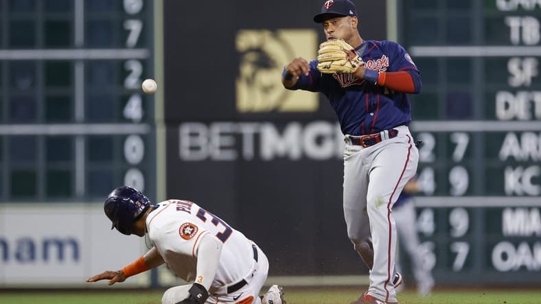 Aug 23, 2022; Houston, Texas, USA; Houston Astros shortstop Jeremy Pena (3) is out at second base as Minnesota Twins second baseman Jorge Polanco (11) throws to first base during the eighth inning at Minute Maid Park. Mandatory Credit: Troy Taormina-USA TODAY Sports