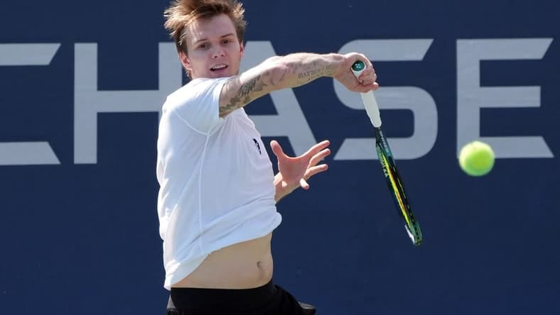 Aug 31, 2022; Flushing, NY, USA;  Alexander Bublik of Kazakhstan hits a shot against Pablo Carreno Busta of Spain on day three of the 2022 U.S. Open tennis tournament at USTA Billie Jean King Tennis Center. Mandatory Credit: Jerry Lai-USA TODAY Sports
