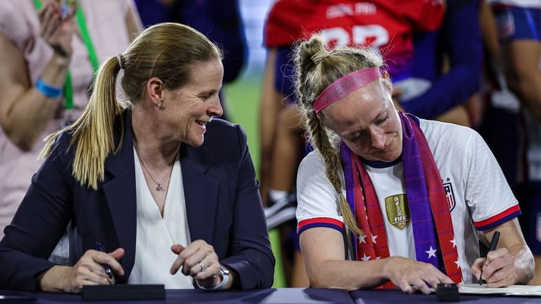 Sep 6, 2022; Washington, District of Columbia, USA; United States Soccer Federation President Cindy Parlow Cone and United States defender Becky Sauerbrunn (4) sign the new Collective Bargaining Agreements after the match between the United States and Nigeria at Audi Field. Mandatory Credit: Scott Taetsch-USA TODAY Sports