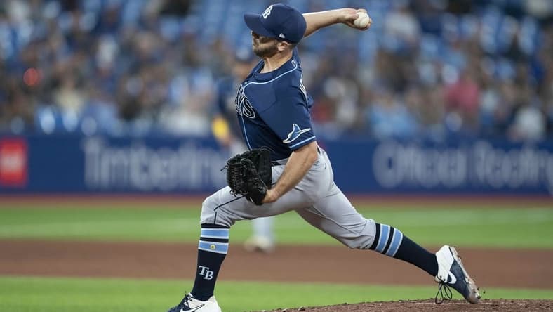 Sep 13, 2022; Toronto, Ontario, CAN; Tampa Bay Rays relief pitcher Kevin Herget (44) throws a pitch against the Toronto Blue Jays during the seventh inning at Rogers Centre. Mandatory Credit: Nick Turchiaro-USA TODAY Sports
