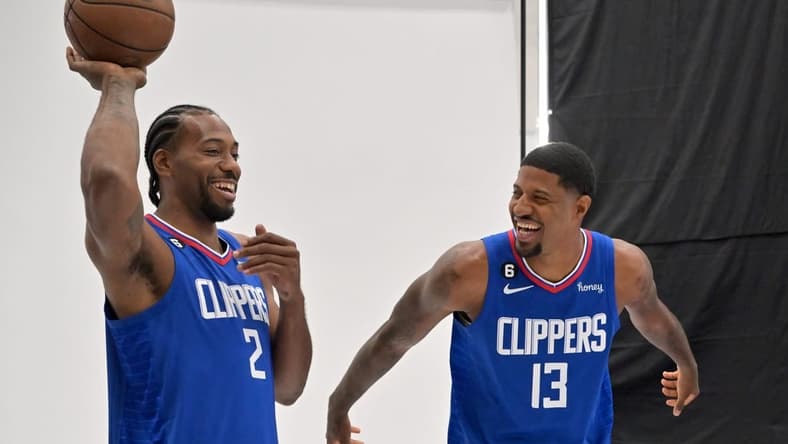 Sep 26, 2022; Playa Vista, CA, USA;  Los Angeles Clippers forward Kawhi Leonard (2) and Los Angeles Clippers guard Paul George (13) are photographed on media day at The Honey Training Center in Playa Vista, CA. Mandatory Credit: Jayne Kamin-Oncea-USA TODAY Sports