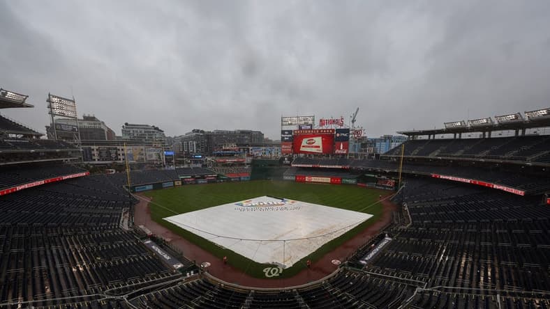 Oct 2, 2022; Washington, District of Columbia, USA; A general view of the tarp on the field during a rain delay in the game between the Washington Nationals and the Philadelphia Phillies at Nationals Park. Mandatory Credit: Scott Taetsch-USA TODAY Sports