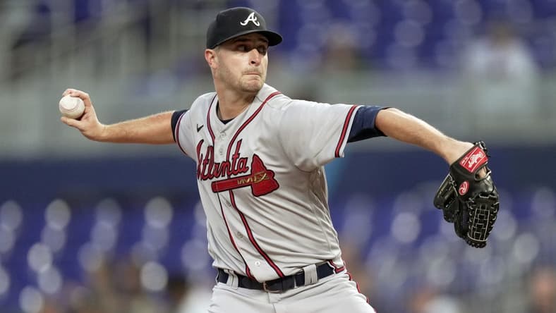 Oct 4, 2022; Miami, Florida, USA; Atlanta Braves starting pitcher Jake Odorizzi (12) delivers in the first inning against the Miami Marlins at loanDepot Park. Mandatory Credit: Jim Rassol-USA TODAY Sports