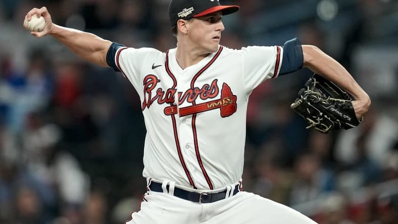 Oct 12, 2022; Atlanta, Georgia, USA; Atlanta Braves starting pitcher Kyle Wright (30) throws against the Philadelphia Phillies in the first inning during game two of the NLDS for the 2022 MLB Playoffs at Truist Park. Mandatory Credit: Dale Zanine-USA TODAY Sports