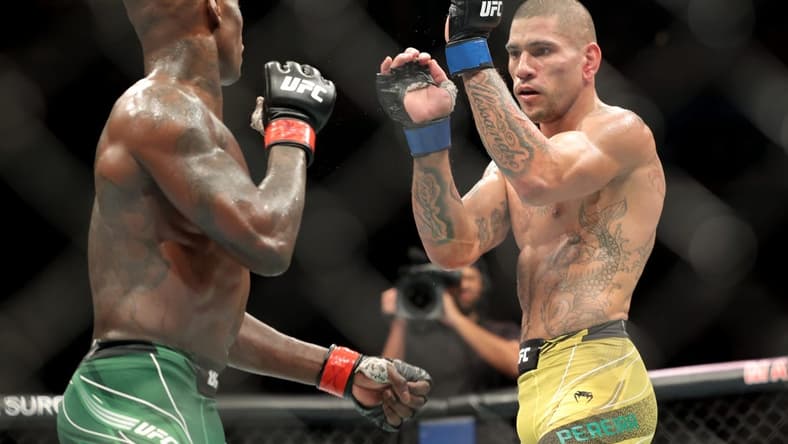Nov 12, 2022; New York, NY, USA; Israel Adesanya (red gloves) and Alex Pereira (blue gloves) during UFC 281 at Madison Square Garden. Mandatory Credit: Jessica Alcheh-USA TODAY Sports