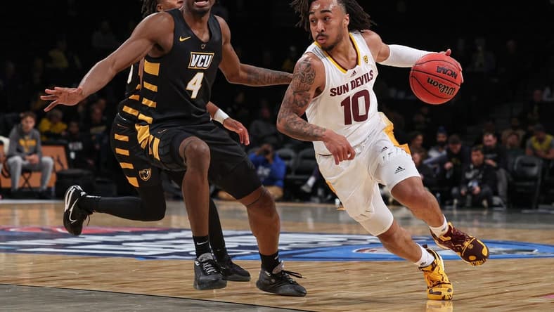 Nov 16, 2022; Brooklyn, New York, USA; Arizona State Sun Devils guard Frankie Collins (10) dribbles against Virginia Commonwealth Rams forward Jalen DeLoach (4) during the first half at Barclays Center. Mandatory Credit: Vincent Carchietta-USA TODAY Sports
