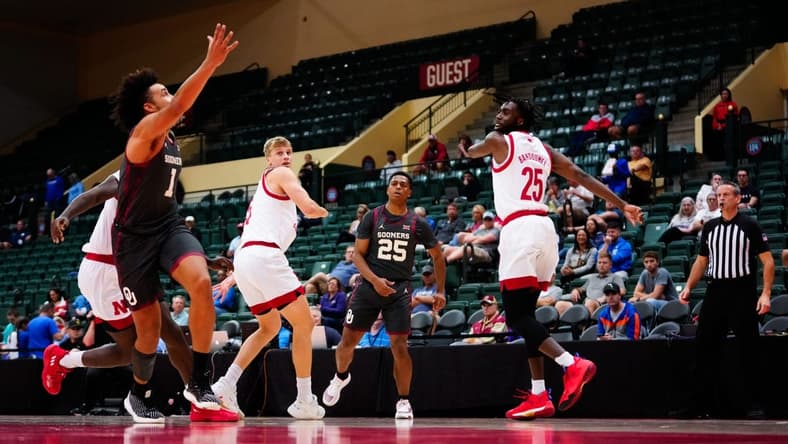 Nov 24, 2022; Orlando, Florida, USA; Oklahoma Sooners guard Grant Sherfield (25) throws a pass to forward Jalen Hill (1) against the Nebraska Cornhuskers during the first half at State Farm Field House. Mandatory Credit: Rich Storry-USA TODAY Sports