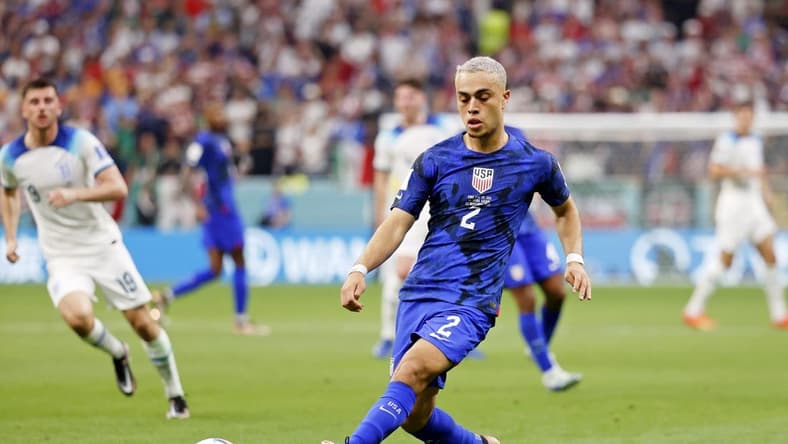 Nov 25, 2022; Al Khor, Qatar; United States of America defender Sergino Dest (2) kicks the ball against England during the second half of a group stage match during the 2022 World Cup at Al Bayt Stadium. Mandatory Credit: Yukihito Taguchi-USA TODAY Sports