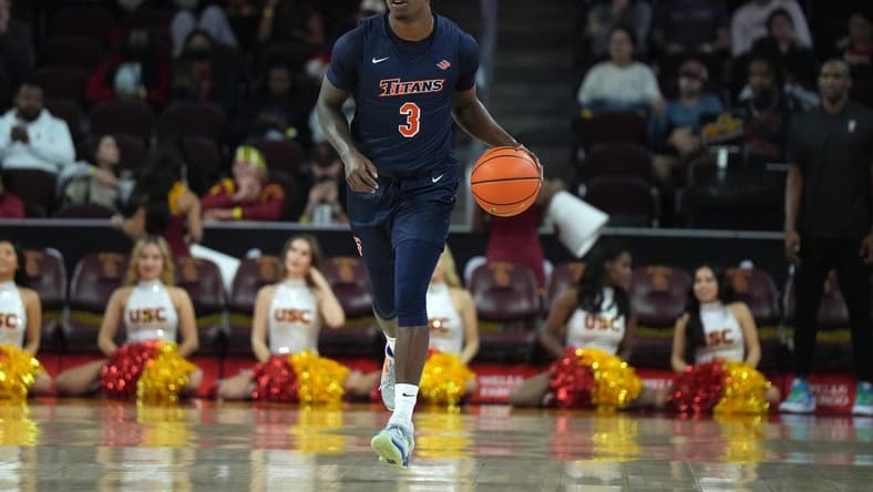 Dec 7, 2022; Los Angeles, California, USA; Cal State Fullerton Titans guard Latrell Wrightsell Jr. (3) dribbles the ball against the Southern California Trojans in the first half at Galen Center. Mandatory Credit: Kirby Lee-USA TODAY Sports