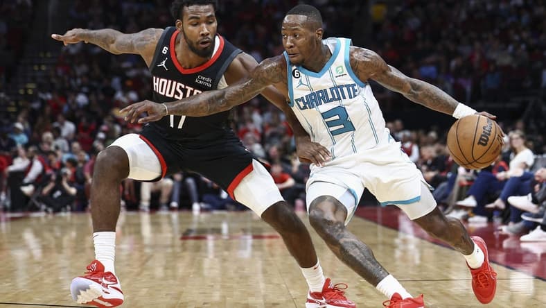 Jan 18, 2023; Houston, Texas, USA;  Charlotte Hornets guard Terry Rozier (3) controls the ball as Houston Rockets forward Tari Eason (17) defends during the third quarter at Toyota Center. Mandatory Credit: Troy Taormina-USA TODAY Sports