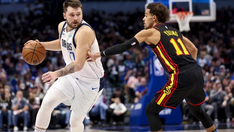 Jan 18, 2023; Dallas, Texas, USA;  Dallas Mavericks guard Luka Doncic (77) drives to the basket as Atlanta Hawks guard Trae Young (11) defends during the second half at American Airlines Center. Mandatory Credit: Kevin Jairaj-USA TODAY Sports