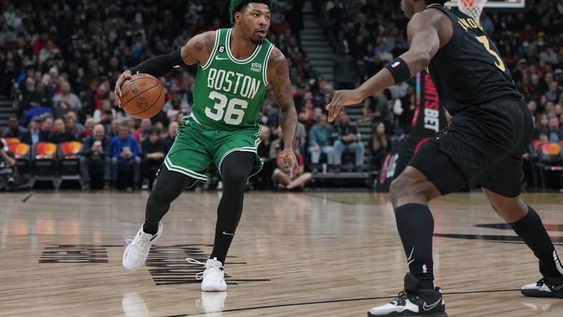 Jan 21, 2023; Toronto, Ontario, CAN; Boston Celtics guard Marcus Smart (36) controls the ball asToronto Raptors forward O.G. Anunoby (3) tries to defend during the first quarter at Scotiabank Arena. Mandatory Credit: Nick Turchiaro-USA TODAY Sports