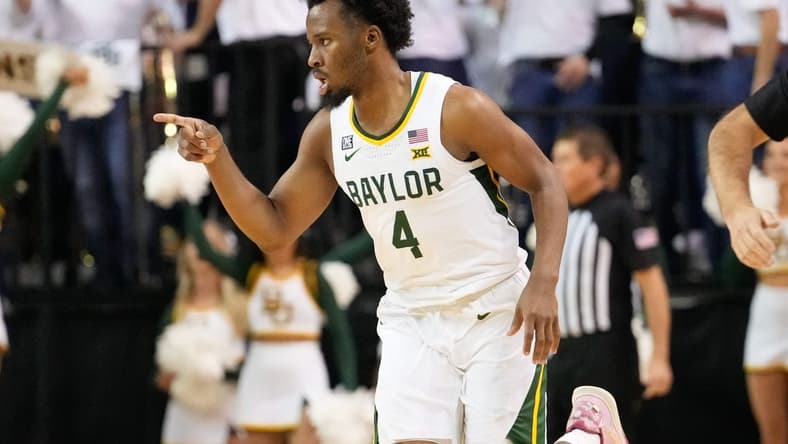 Jan 23, 2023; Waco, Texas, USA; Baylor Bears guard LJ Cryer (4) reacts after scoring a three-point basket against the Kansas Jayhawks during the first half at Ferrell Center. Mandatory Credit: Chris Jones-USA TODAY Sports
