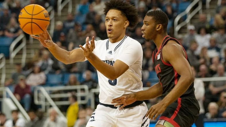Nevada guard Darrion Williams passes the ball against San Diego State guard during the first half of a basketball game played at Lawlor Events Center in Reno, Nev., Tuesday, Jan. 31, 2023.

San Diego St At Nevada Basketball 02 Copy Copy