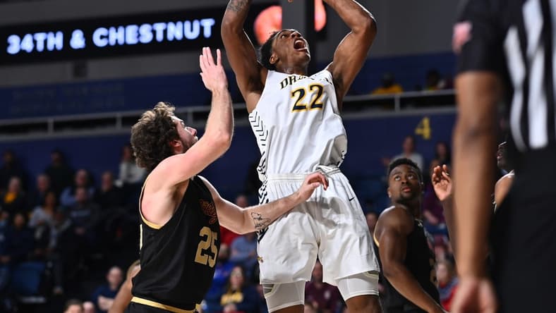 Feb 2, 2023; Philadelphia, Pennsylvania, USA; Drexel Dragons forward Amari Williams (22) shoots over Charleston Cougars forward Ben Burnham (25) in the second half at Daskalakis Athletic Center. Mandatory Credit: Kyle Ross-USA TODAY Sports
