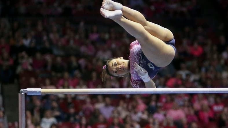 Feb 3, 2023; Tuscaloosa, AL, USA; Auburn gymnast Suni Lee competes on the bars where she scored a perfect 10.0 at Coleman Coliseum. Alabama edged Auburn 197.850 to 197.700.
Ncaa Gymnastics Power Of Pink Meet Alabama Vs Auburn