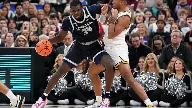 Feb 8, 2023; Providence, Rhode Island, USA; Georgetown Hoyas center Qudus Wahab (34) works against Providence Friars forward Ed Croswell (5) during the first half at Amica Mutual Pavilion. Mandatory Credit: Eric Canha-USA TODAY Sports