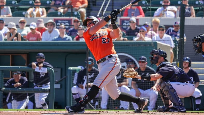 Feb 26, 2023; Lakeland, Florida, USA; Baltimore Orioles catcher James McCann (27) bats against the Detroit Tigers at Publix Field at Joker Marchant Stadium. Mandatory Credit: Mike Watters-USA TODAY Sports