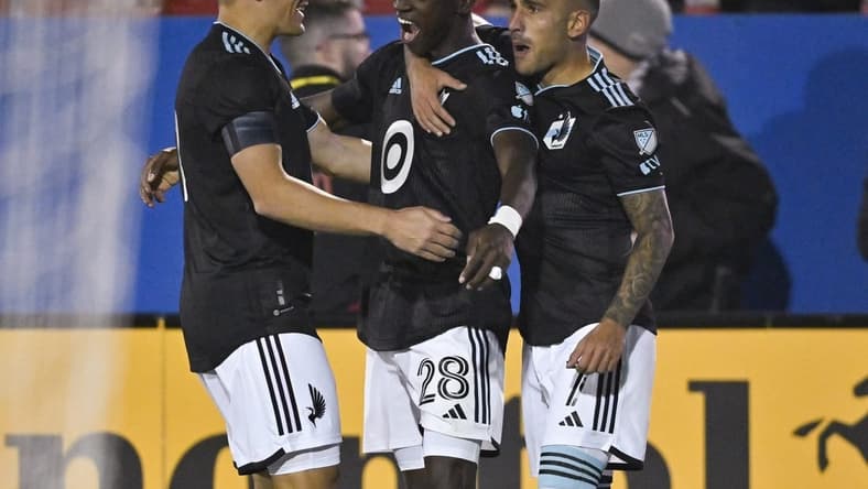 Feb 25, 2023; Frisco, Texas, USA; Minnesota United forward Mender Garcia (28) and forward Franco Fragapane (7) and midfielder Robin Lod (17) celebrate a goal during the game between Minnesota United and FC Dallas at the Toyota Stadium. Mandatory Credit: Jerome Miron-USA TODAY Sports