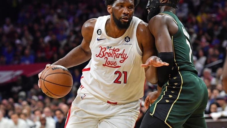 Feb 25, 2023; Philadelphia, Pennsylvania, USA; Philadelphia 76ers center Joel Embiid (21) drives to the basket against Boston Celtics guard Jaylen Brown (7) at Wells Fargo Center. Mandatory Credit: Eric Hartline-USA TODAY Sports