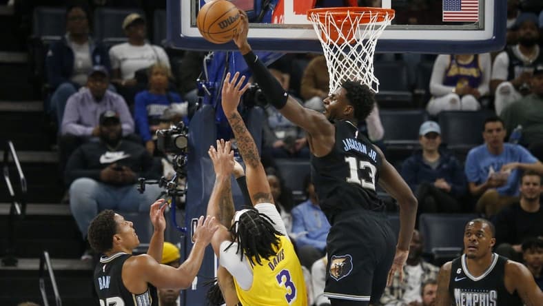 Feb 28, 2023; Memphis, Tennessee, USA; Memphis Grizzlies forward Jaren Jackson Jr. (13) blocks the shot of Los Angeles Lakers forward Anthony Davis (3) during the first half at FedExForum. Mandatory Credit: Petre Thomas-USA TODAY Sports