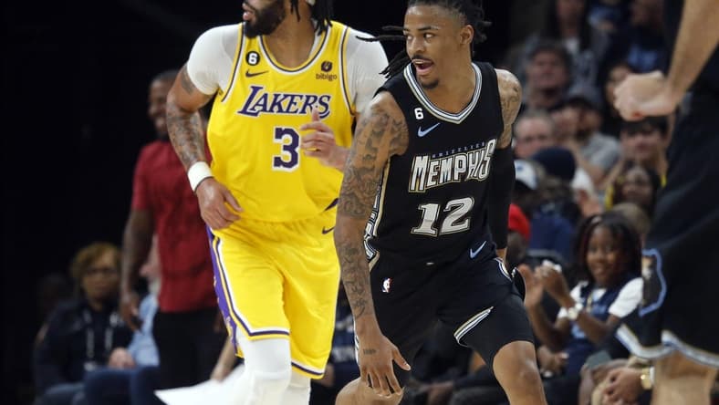 Feb 28, 2023; Memphis, Tennessee, USA; Memphis Grizzlies guard Ja Morant (12) reacts during the second half against the Los Angeles Lakers at FedExForum. Mandatory Credit: Petre Thomas-USA TODAY Sports