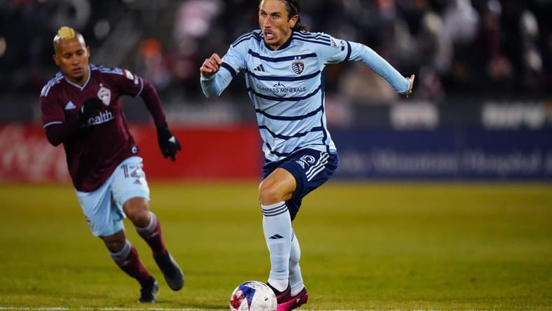 Mar 4, 2023; Commerce City, Colorado, USA; Sporting Kansas City defender Ben Sweat (2) breaks away with the ball during the second half against the Colorado Rapids at Dick's Sporting Goods Park. Mandatory Credit: Ron Chenoy-USA TODAY Sports