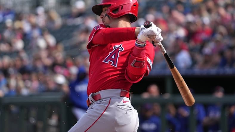 Mar 5, 2023; Surprise, Arizona, USA; Los Angeles Angels infielder Zach Neto (94) bats against the Texas Rangers during the fourth inning at Surprise Stadium. Mandatory Credit: Joe Camporeale-USA TODAY Sports