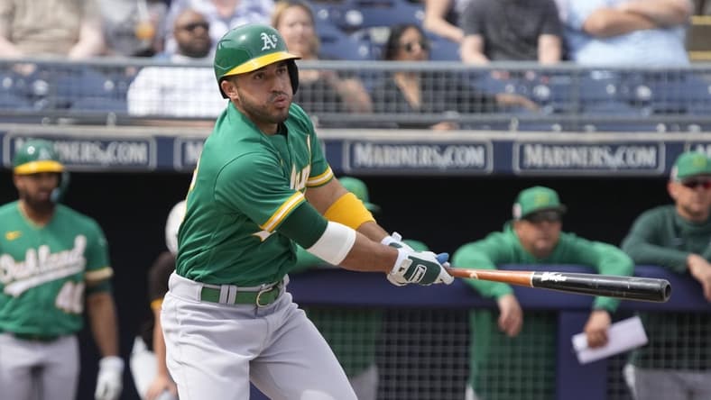 Mar 5, 2023; Peoria, Arizona, USA; Oakland Athletics right fielder Ramon Laureano (22) hits against the San Diego Padres in the first inning at Peoria Sports Complex. Mandatory Credit: Rick Scuteri-USA TODAY Sports