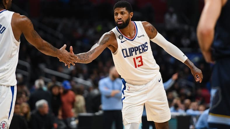 Mar 5, 2023; Los Angeles, California, USA; LA Clippers forward Paul George (13) celebrates with forward Kawhi Leonard (2) against [WHO] during fourth quarter at Crypto.com Arena. Mandatory Credit: Jonathan Hui-USA TODAY Sports
