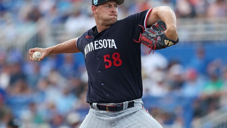 Mar 8, 2023; Dunedin, Florida, USA;  Minnesota Twins relief pitcher Trevor Megill (58) throws a pitch against the Toronto Blue Jays in the fifth inning during spring training at TD Ballpark. Mandatory Credit: Nathan Ray Seebeck-USA TODAY Sports