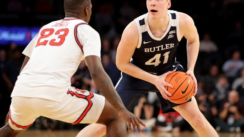 Mar 8, 2023; New York, NY, USA; Butler Bulldogs guard Simas Lukosius (41) controls the ball against St. John's Red Storm forward David Jones (23) during the first half at Madison Square Garden. Mandatory Credit: Brad Penner-USA TODAY Sports